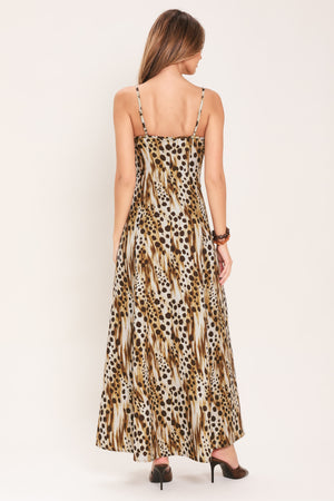 Woman wearing a leopard print maxi dress featuring straight neckline, straps and back zipper closure | Flying Tomato