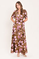 A woman modeling a brown and pink floral maxi dress with puff sleeves and a V-neckline | Flying Tomato