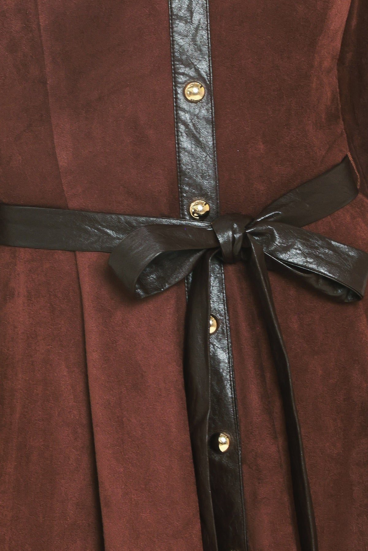 A woman modeling a burgundy suede long-sleeve shirt dress with a black faux-leather collar, button placket, and matching black tie belt | Flying Tomato