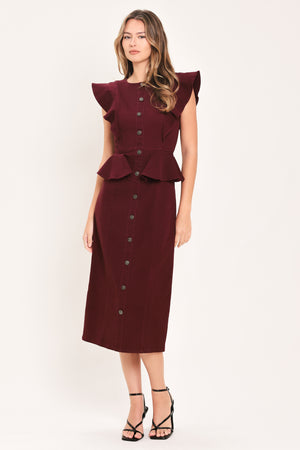 A woman modeling a sleeveless burgundy midi dress with ruffled cap sleeves, a peplum waist, and a front button placket | Flying Tomato