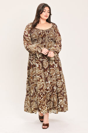 A woman wearing a long-sleeved midi dress with a brown and beige paisley pattern | Flying Tomato Curve