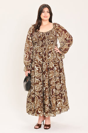 A woman wearing a long-sleeved midi dress with a brown and beige paisley pattern | Flying Tomato Curve