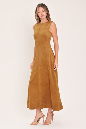 A woman modeling a sleeveless, high-neck, midi-length camel brown dress with a flared skirt | Flying Tomato
