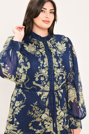 A woman modeling a long-sleeved navy blue maxi dress with a taupe toile floral pattern | Flying Tomato Curve