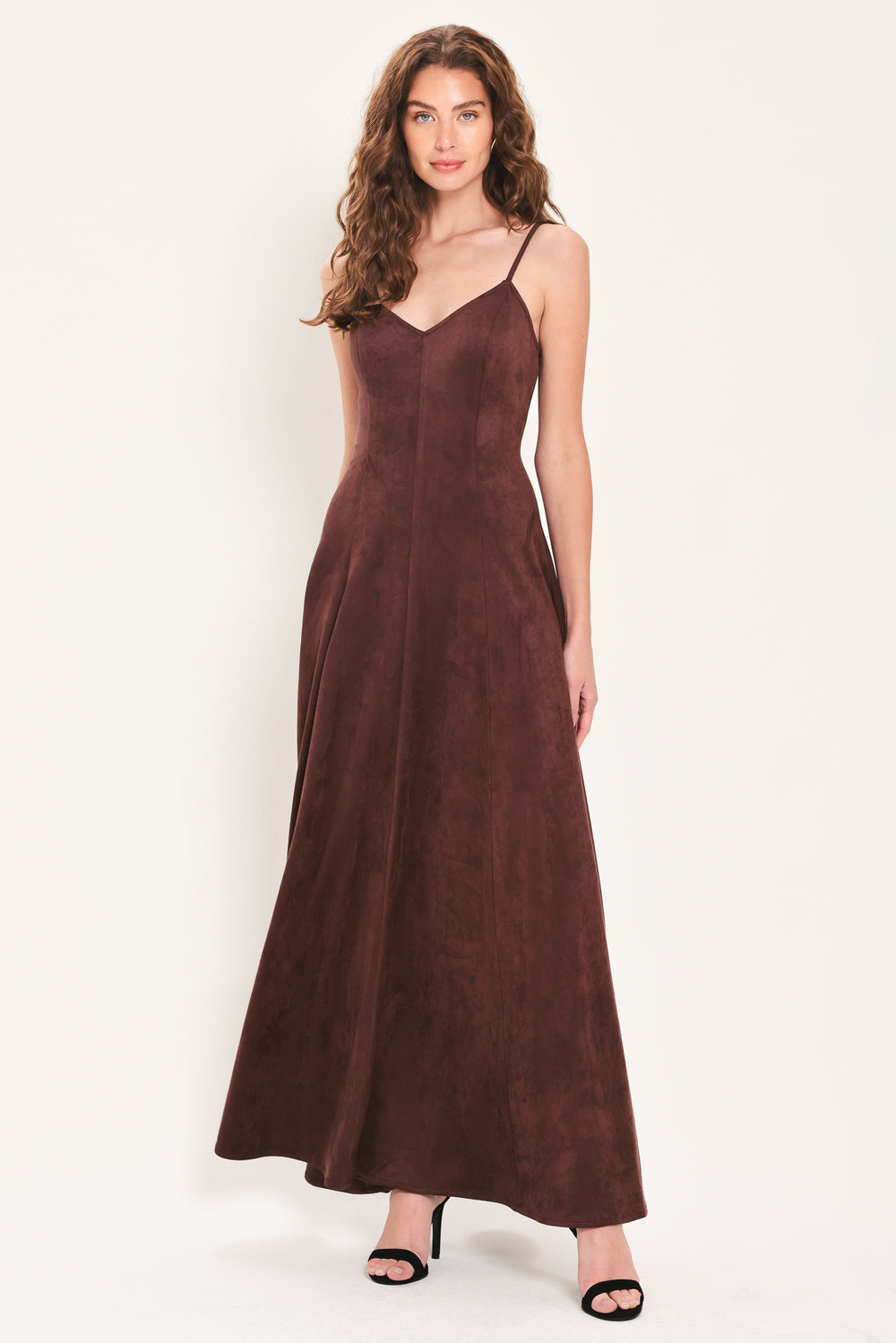 Woman wearing a sleeveless raisin brown suede maxi dress | Flying Tomato