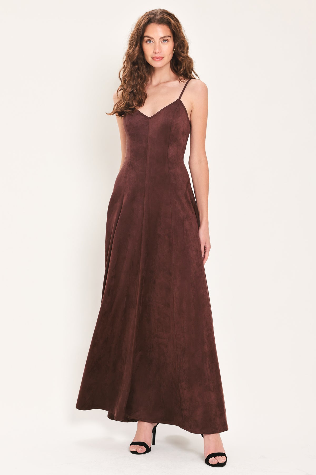 Woman wearing a sleeveless raisin brown suede maxi dress | Flying Tomato
