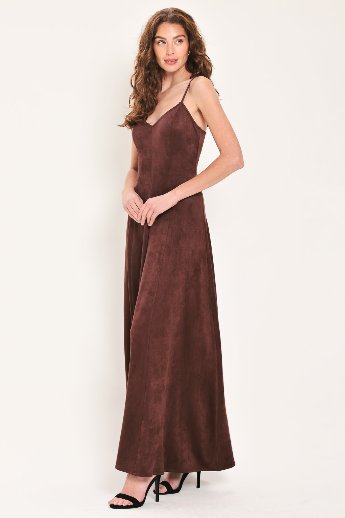 Woman wearing a sleeveless raisin brown suede maxi dress | Flying Tomato