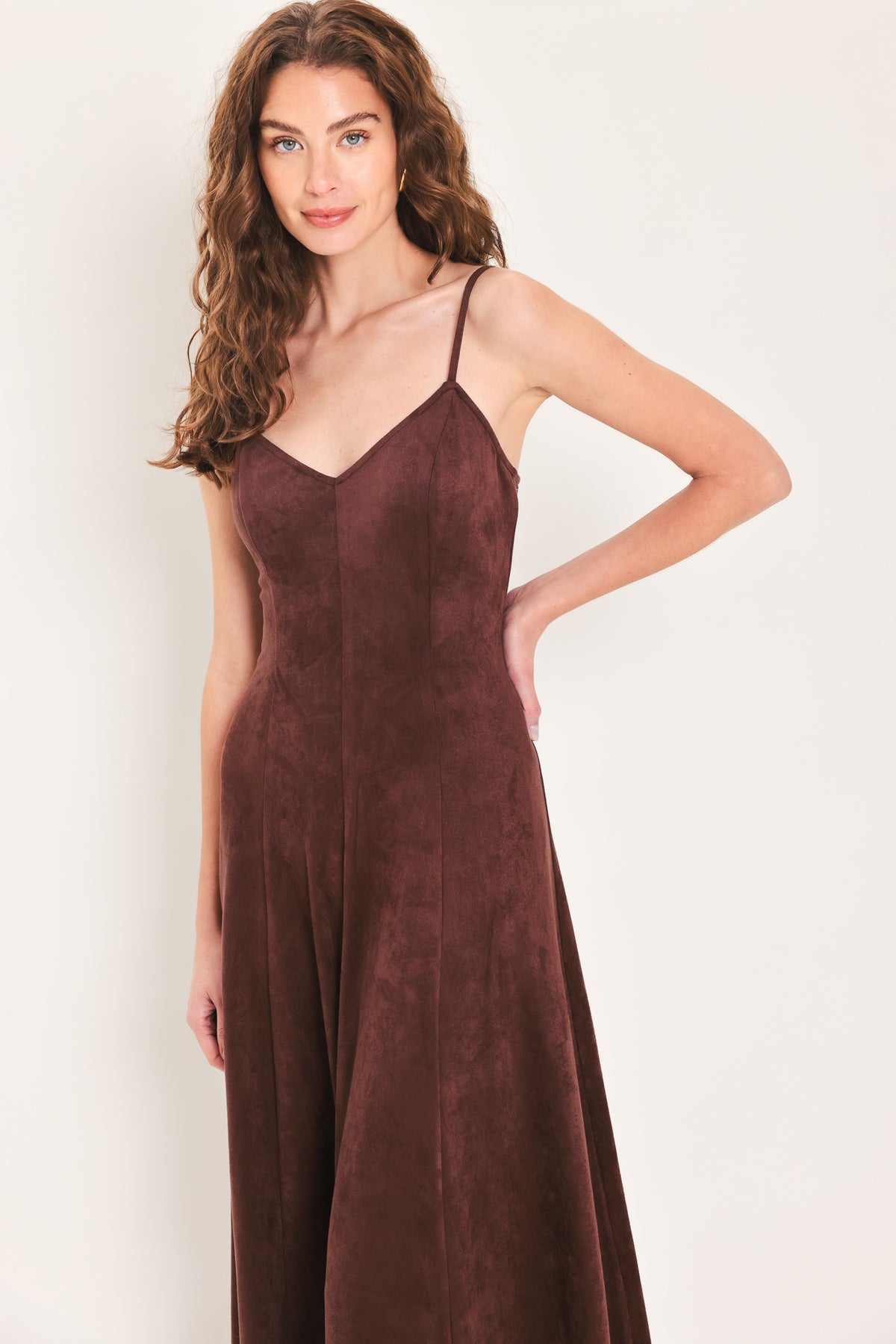 Woman wearing a sleeveless raisin brown suede maxi dress | Flying Tomato