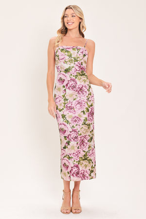 A woman modeling a sleeveless midi dress with thin straps and a ivory and mauve floral print | Flying Tomato