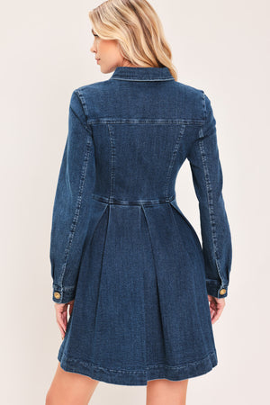 A woman modeling a blue denim long-sleeve shirt dress with gold-tone buttons | Flying Tomato