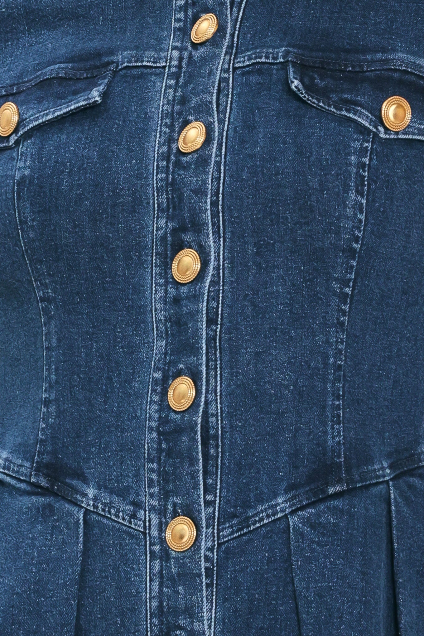 A woman modeling a blue denim long-sleeve shirt dress with gold-tone buttons | Flying Tomato