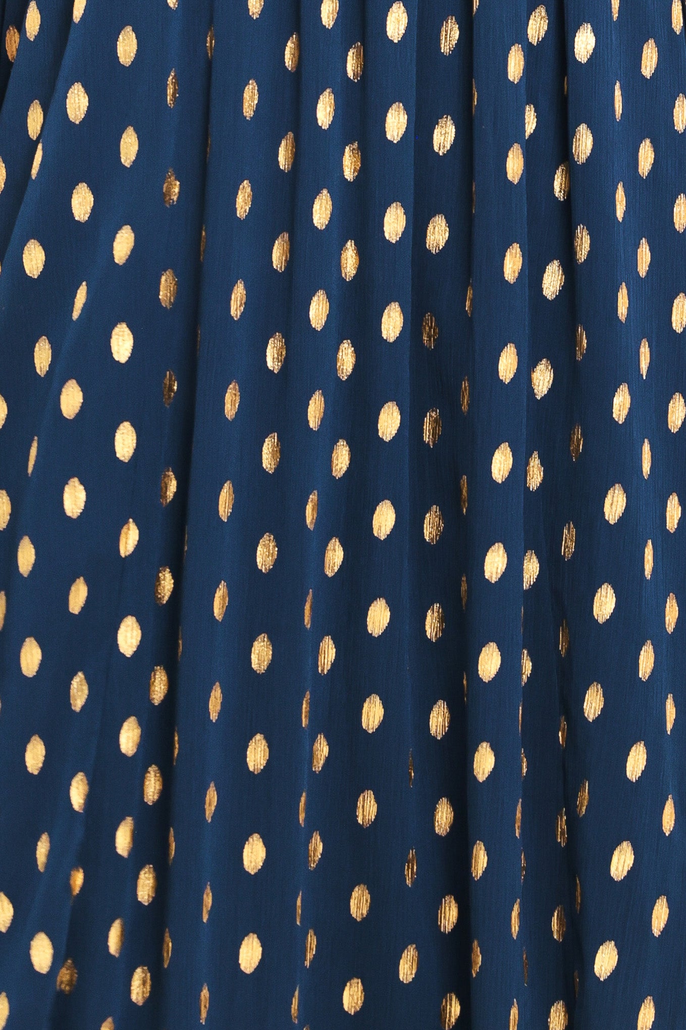 A woman modeling a light yellow midi dress with a small gold dotted pattern, featuring flutter sleeves and a V-neckline | Flying Tomato