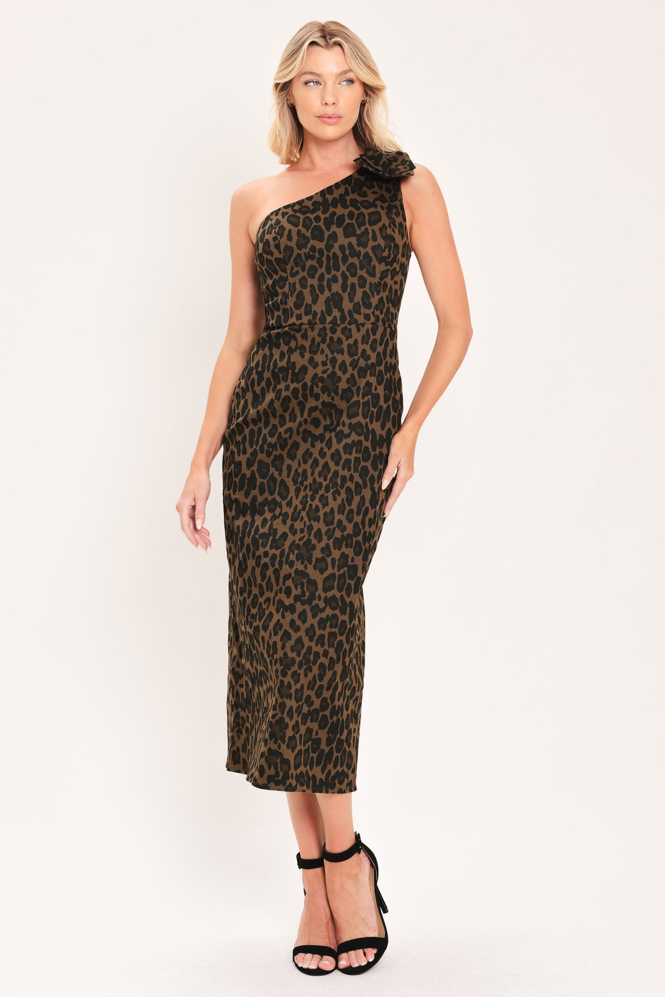 A woman modeling a one-shoulder leopard print midi dress with a oversize bow on the shoulder | Flying Tomato