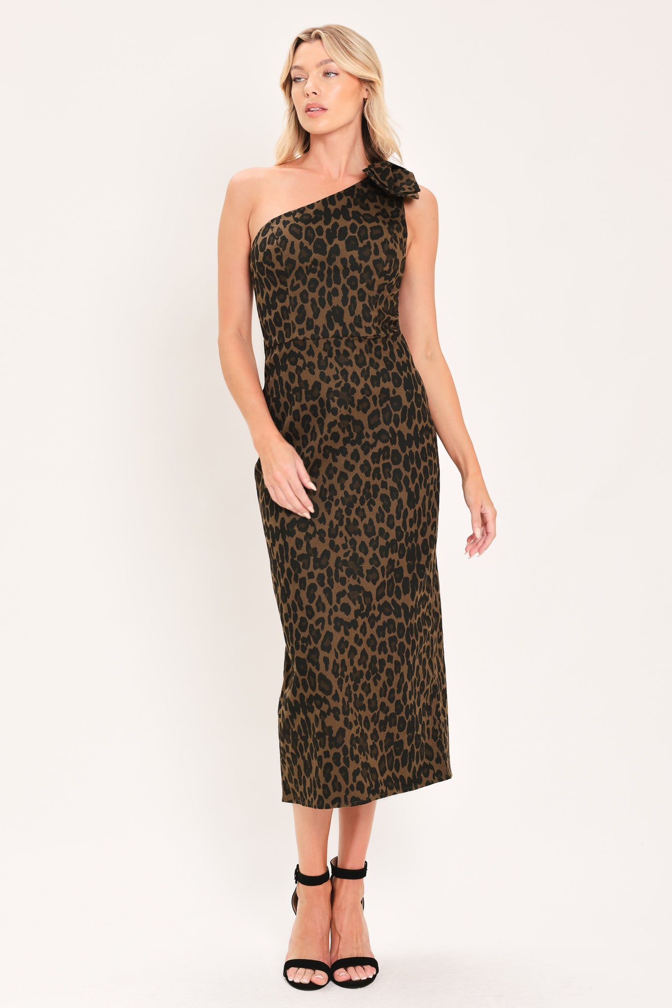 A woman modeling a one-shoulder leopard print midi dress with a oversize bow on the shoulder | Flying Tomato