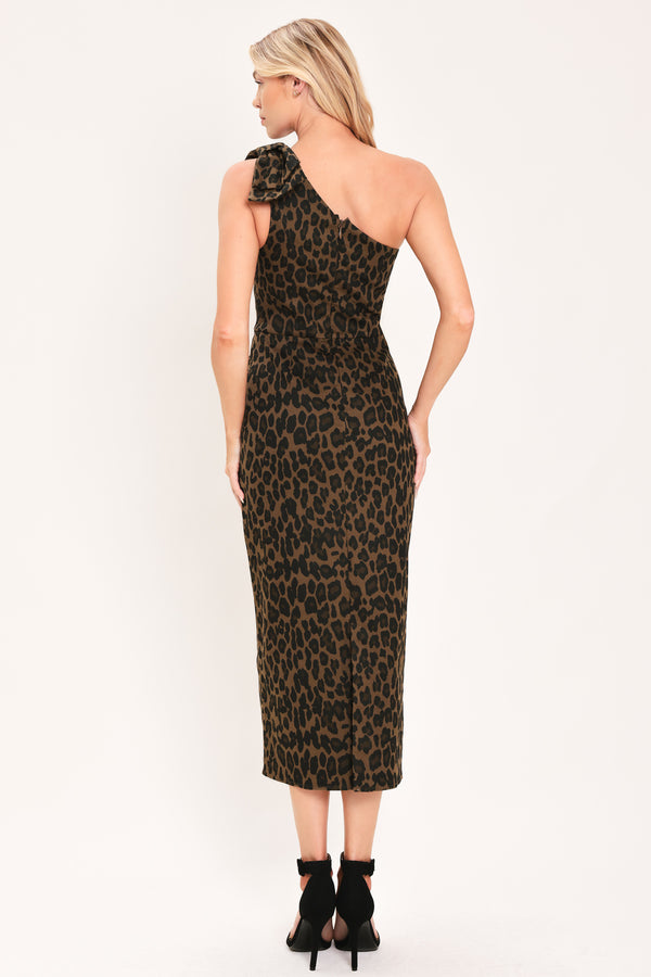 A woman modeling a one-shoulder leopard print midi dress with a oversize bow on the shoulder | Flying Tomato