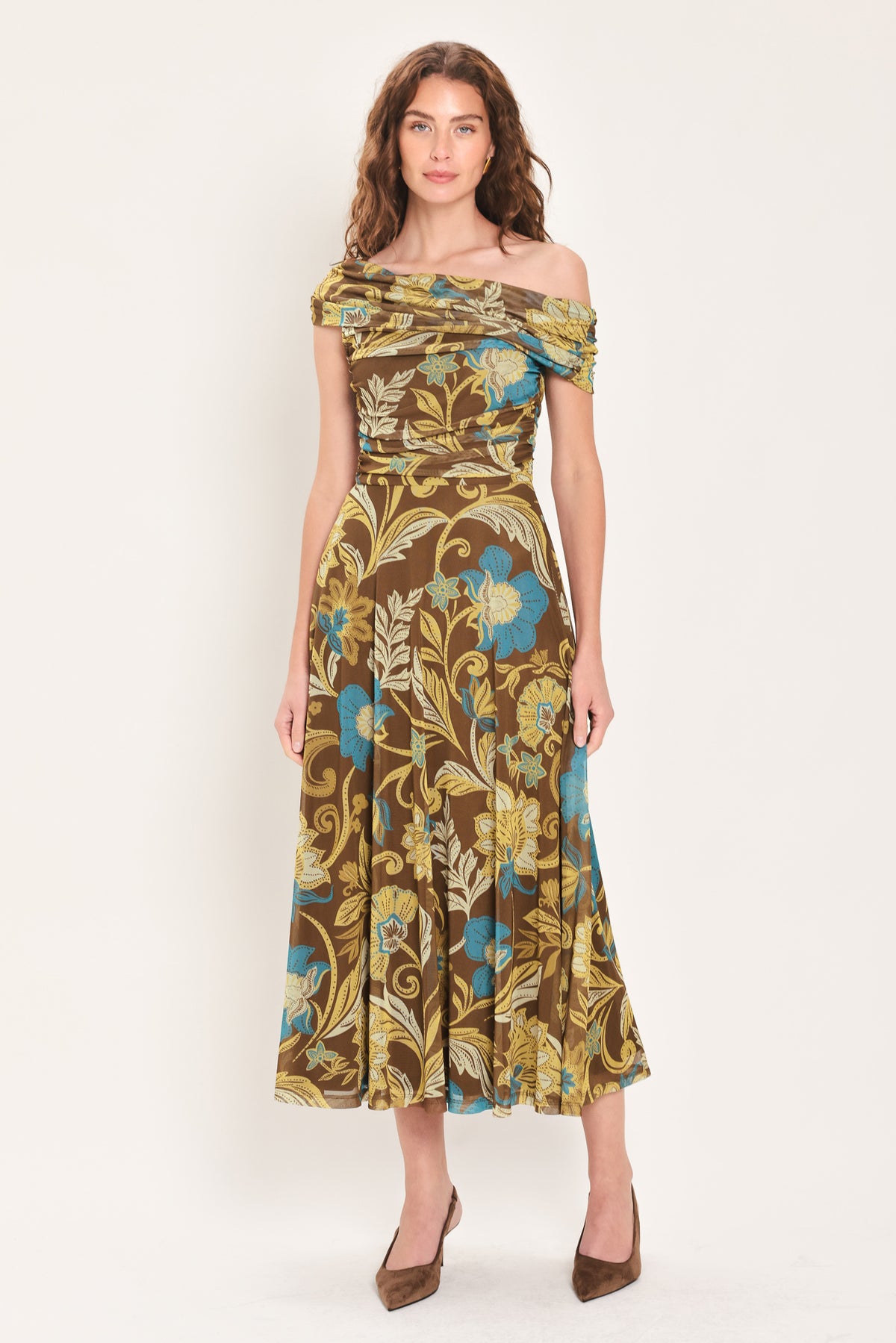 Woman wearing a brown off the shoulder mesh midi dress with teal and gold-tone floral and leaf pattern | Flying Tomato