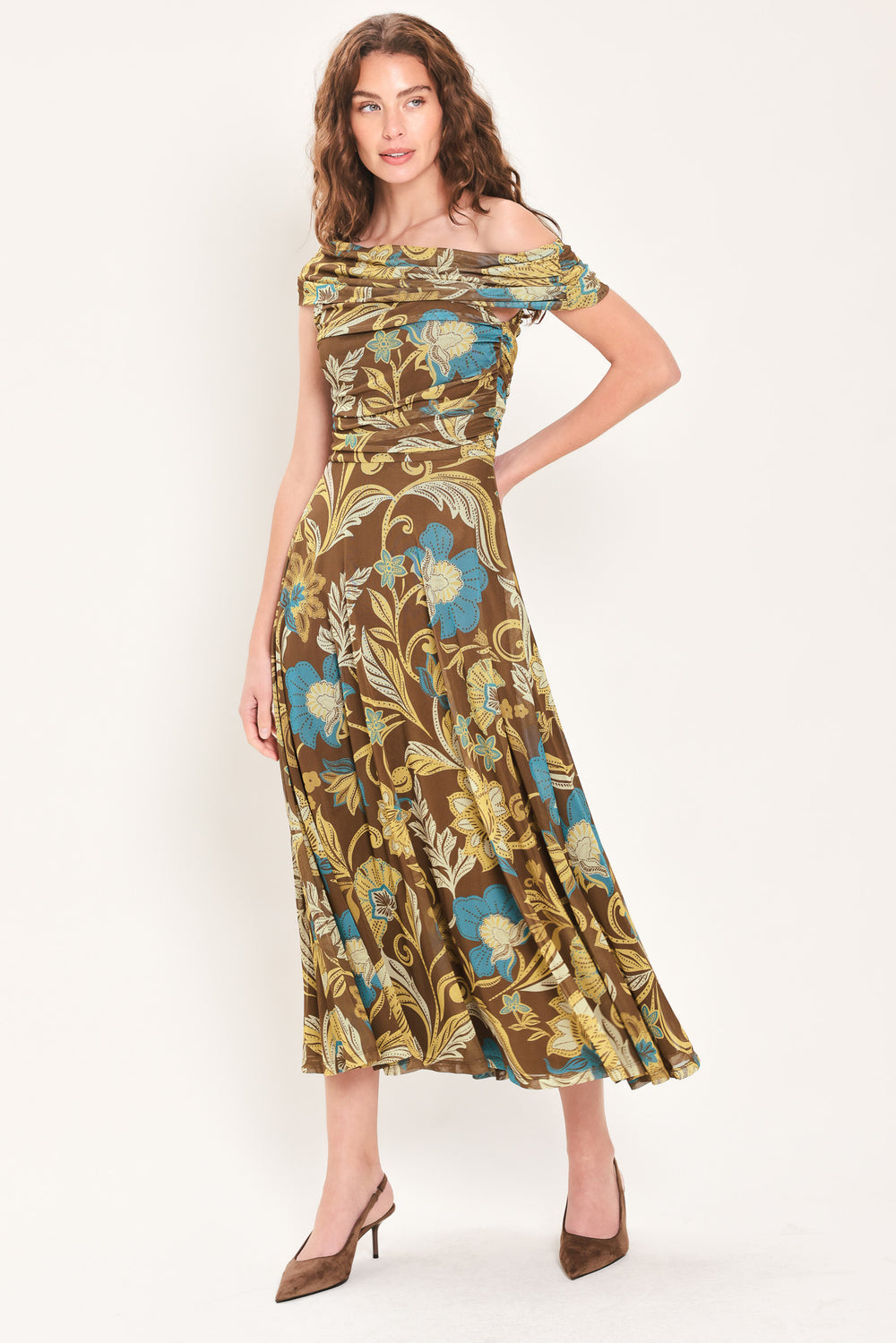 Woman wearing a brown off the shoulder mesh midi dress with teal and gold-tone floral and leaf pattern | Flying Tomato