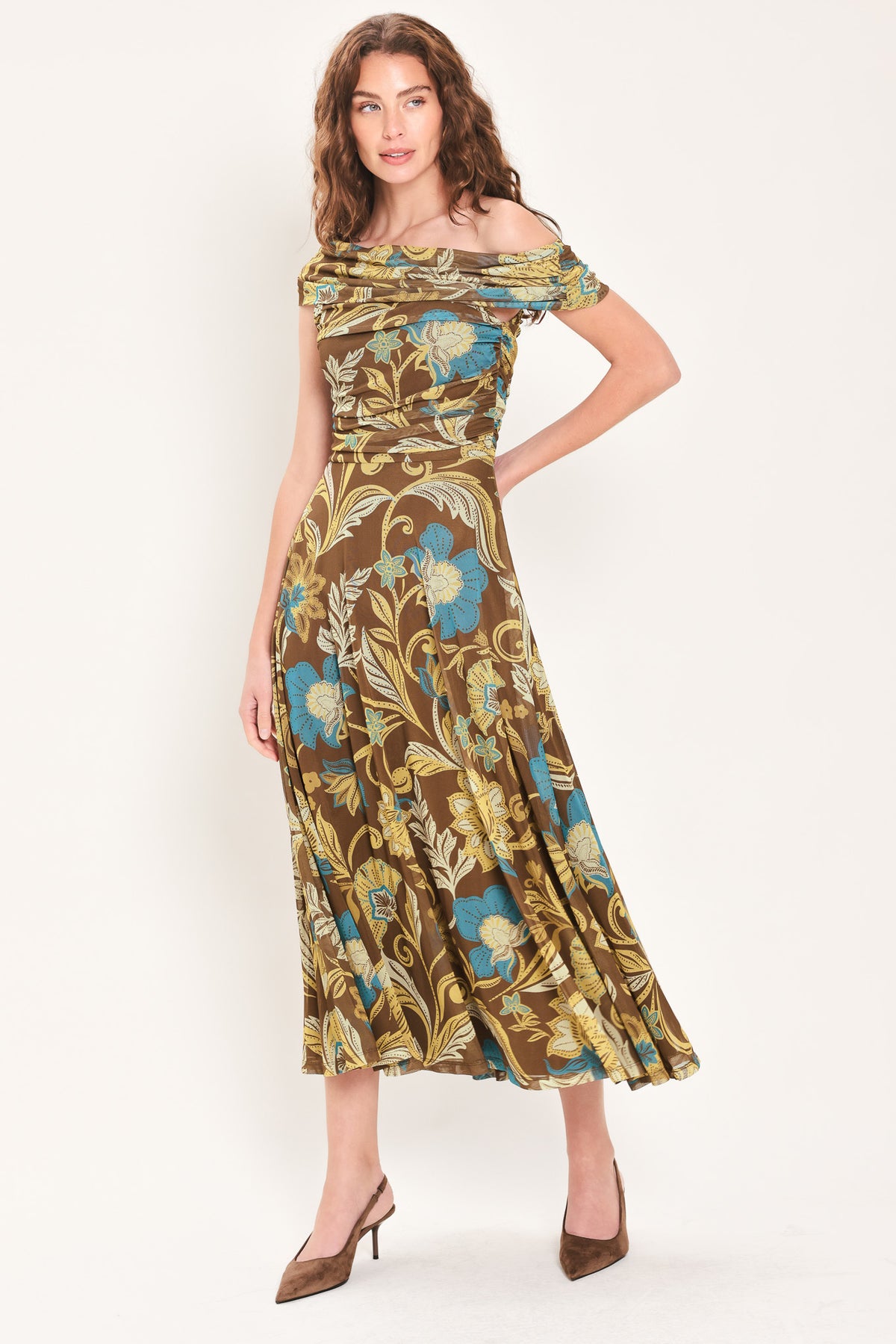 Woman wearing a brown off the shoulder mesh midi dress with teal and gold-tone floral and leaf pattern | Flying Tomato