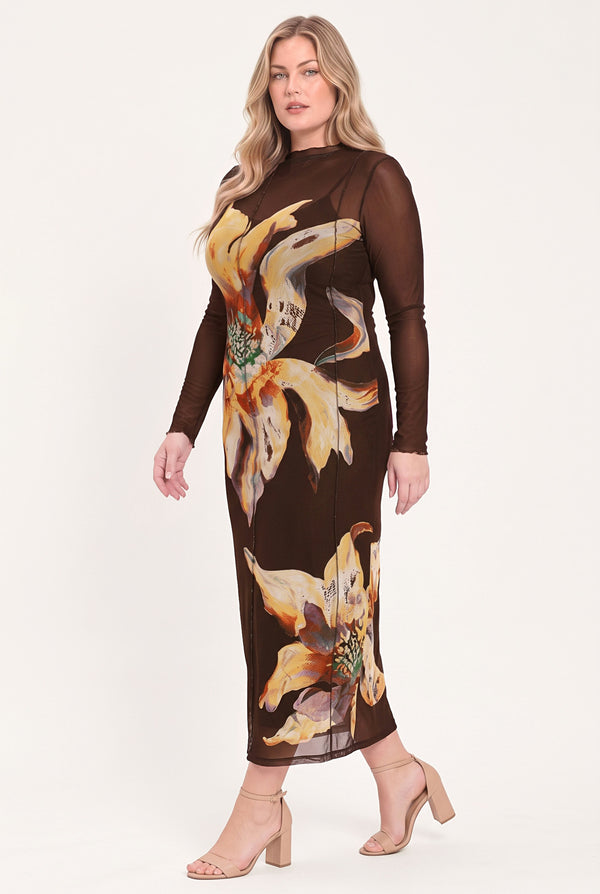 A woman modeling a brown long-sleeve midi dress with sheer mesh sleeves and a large yellow and beige floral print | Flying Tomato