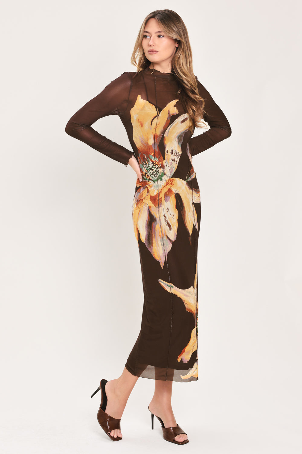 Woman wearing a brown midi mesh dress with a large floral print | Flying Tomato
