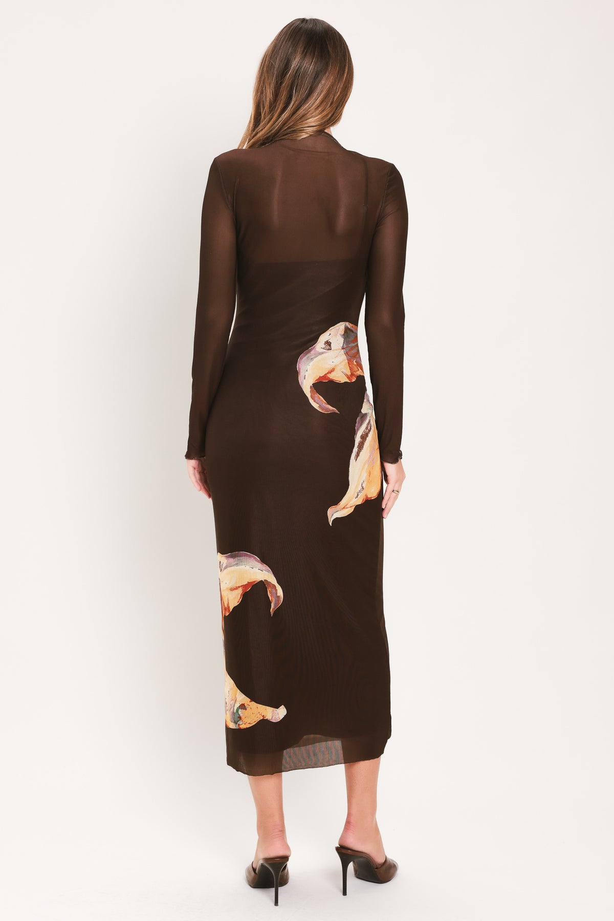 Woman wearing a brown midi mesh dress with a large floral print | Flying Tomato
