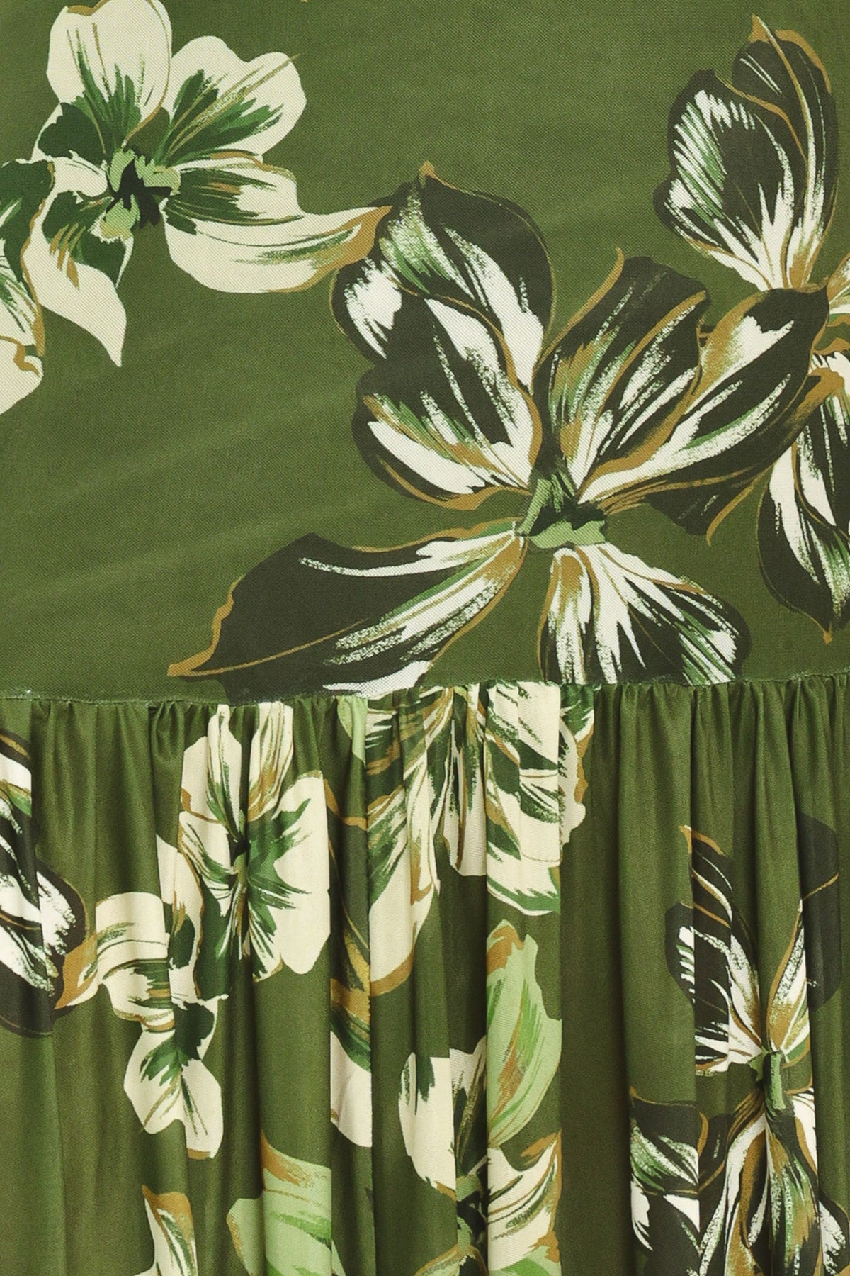 A woman modeling a long-sleeve power mesh maxi dress with a moss green and white tropical floral print | Flying Tomato
