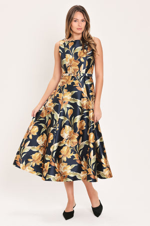 Woman wearing a sleeveless navy midi dress with orange floral pattern and matching belt | Flying Tomato