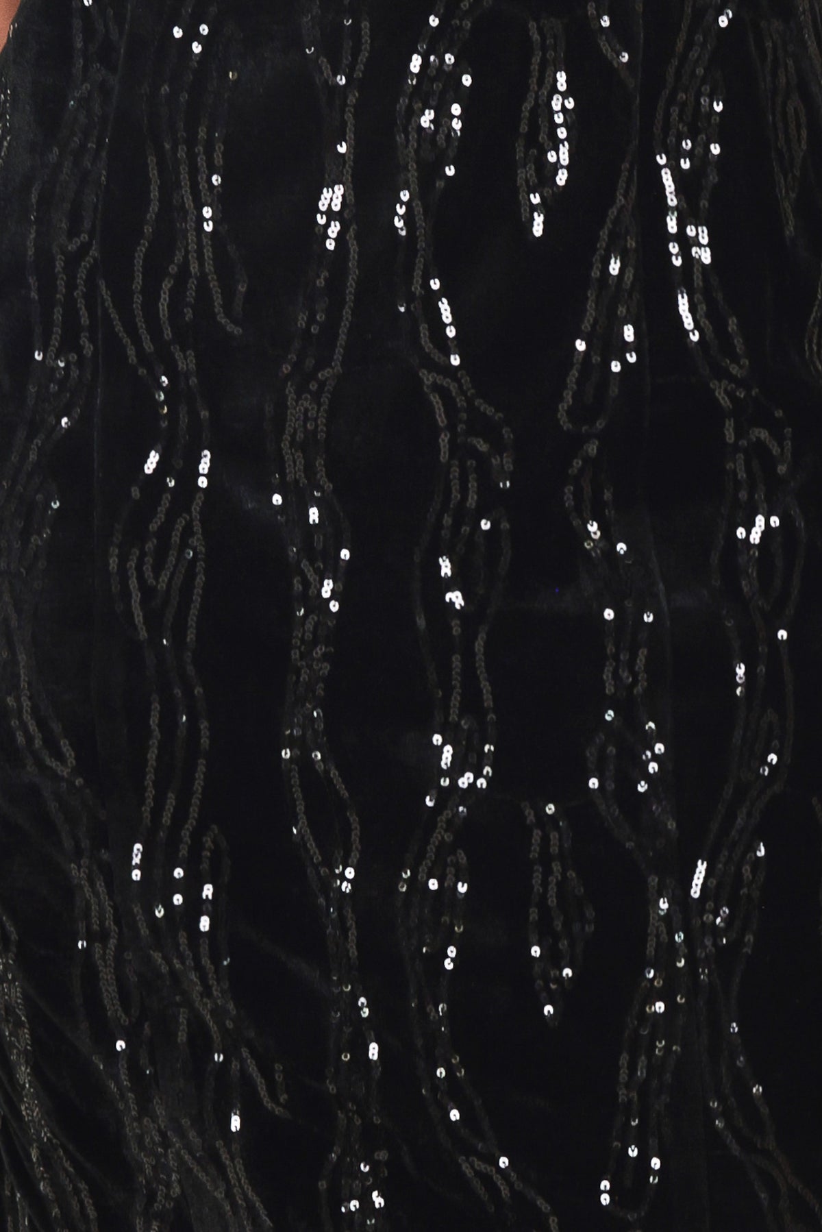A woman modeling a black sequined midi dress with spaghetti straps and a black lace sweetheart neckline | Flying Tomato