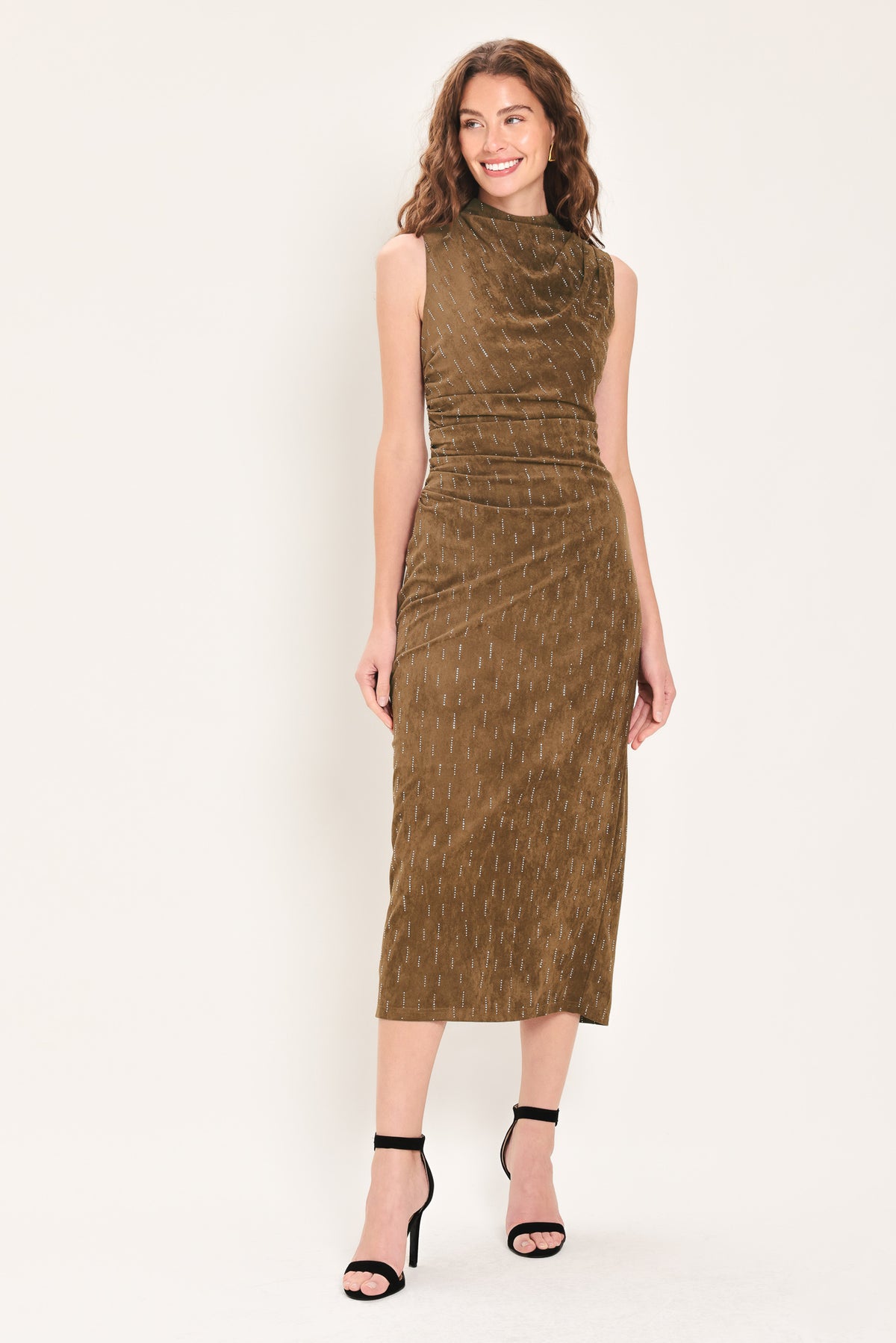 Woman wearing a walnut brown suede sleeveless midi dress with small linear rhinestone embellishments that looks like rain & a ruched waist | Flying Tomato