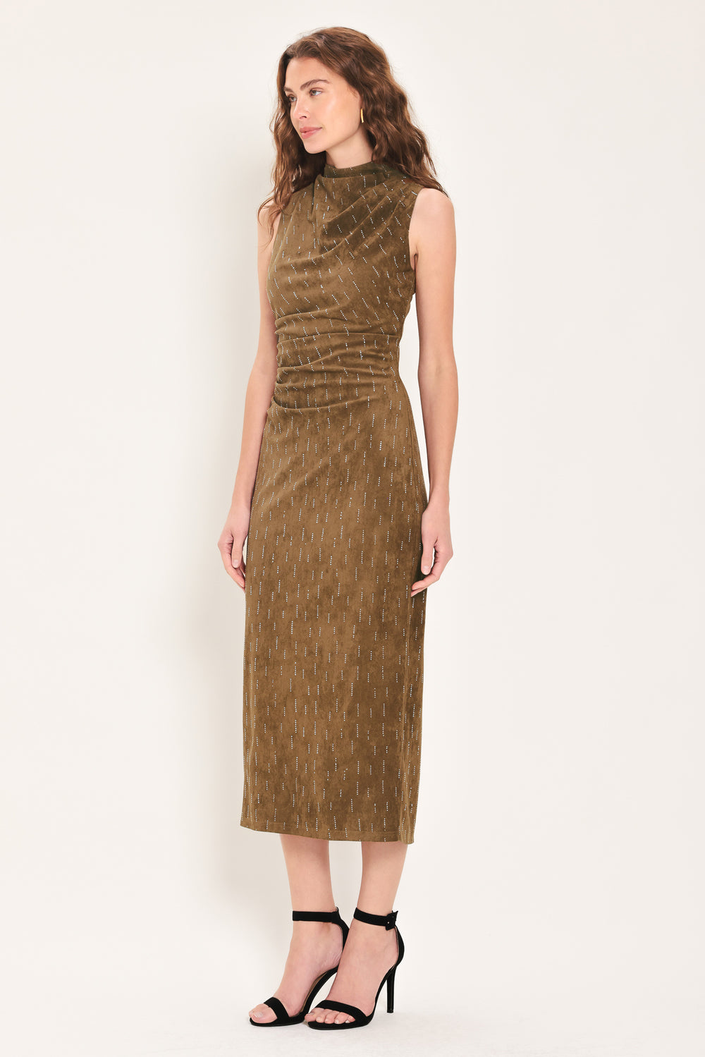 Woman wearing a walnut brown suede sleeveless midi dress with small linear rhinestone embellishments that looks like rain & a ruched waist | Flying Tomato