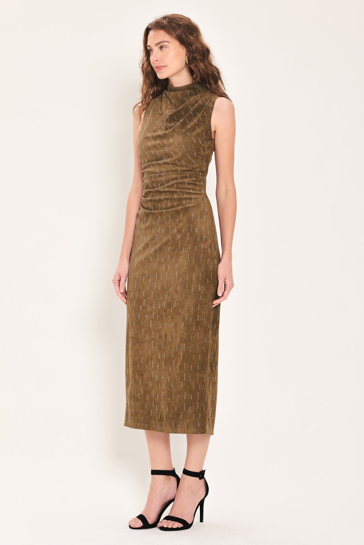 Woman wearing a walnut brown suede sleeveless midi dress with small linear rhinestone embellishments that looks like rain & a ruched waist | Flying Tomato