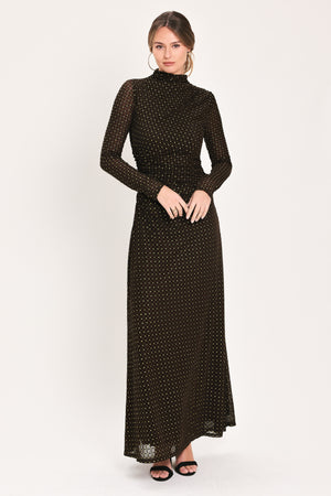 Woman wearing a long sleeve dark brown mesh maxi dress with gold tone rhinestones | Flying Tomato
