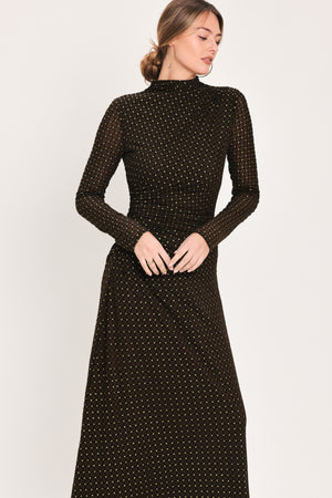 Woman wearing a long sleeve dark brown mesh maxi dress with gold tone rhinestones | Flying Tomato