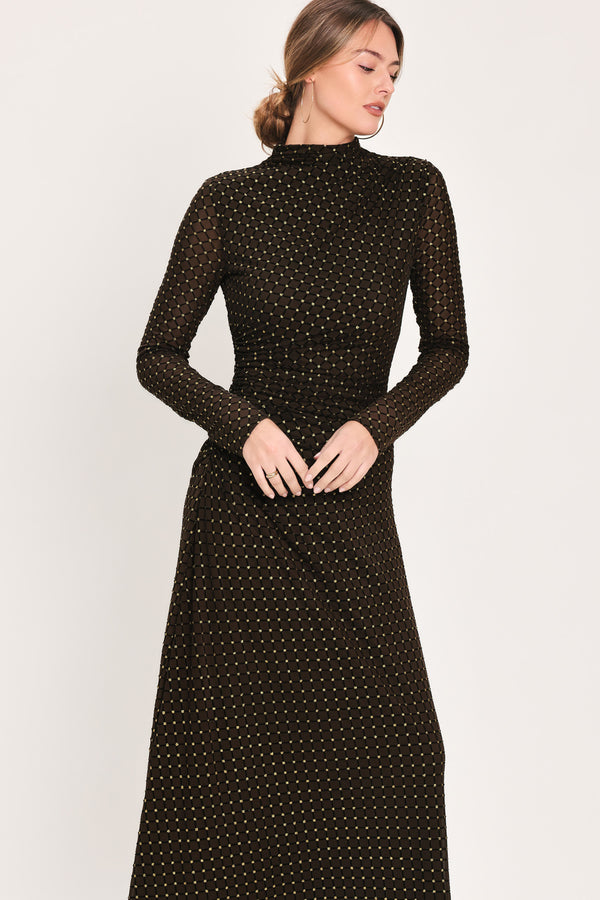 Woman wearing a long sleeve dark brown mesh maxi dress with gold tone rhinestones | Flying Tomato