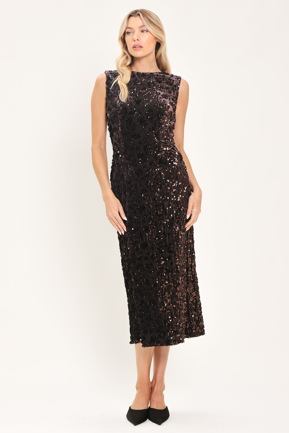 A woman modeling a sleeveless dark brown midi dress covered in shimmering sequins | Flying Tomato