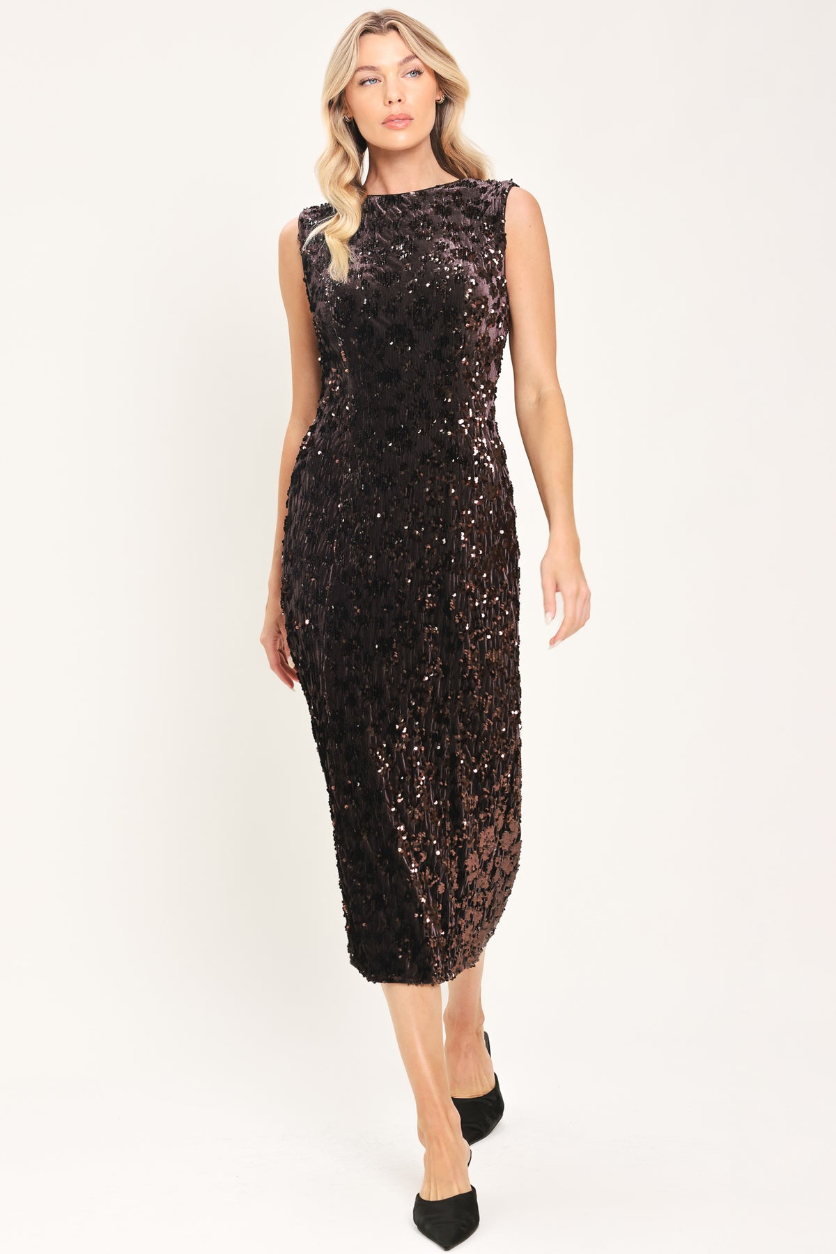 A woman modeling a sleeveless dark brown midi dress covered in shimmering sequins | Flying Tomato