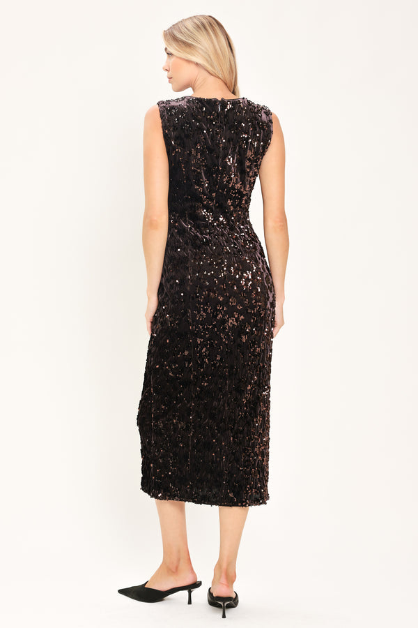 A woman modeling a sleeveless dark brown midi dress covered in shimmering sequins | Flying Tomato