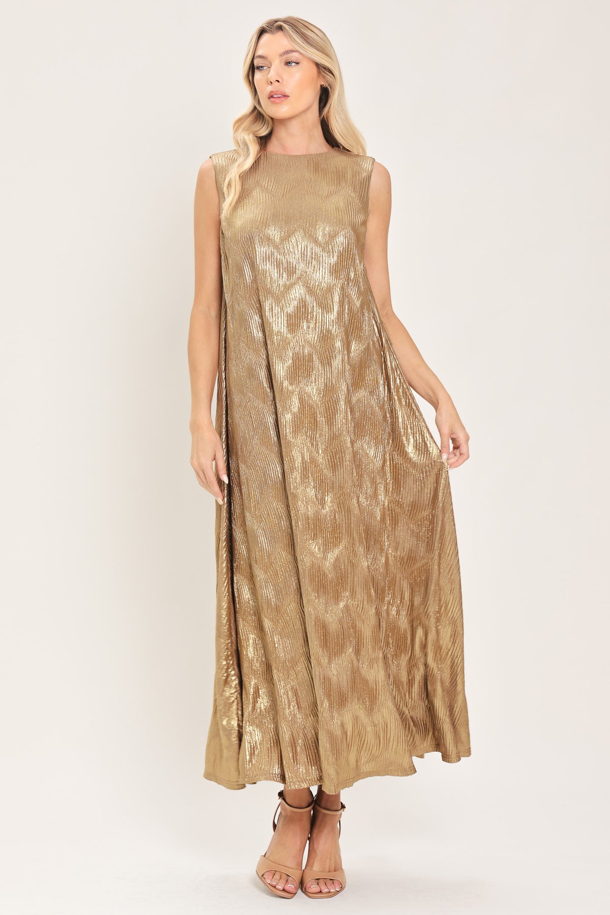 Woman wearing a sleeveless gold metallic like midi dress with dark brown suede waist belt | Flying Tomato