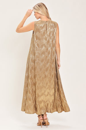 Woman wearing a sleeveless gold metallic like midi dress with dark brown suede waist belt | Flying Tomato