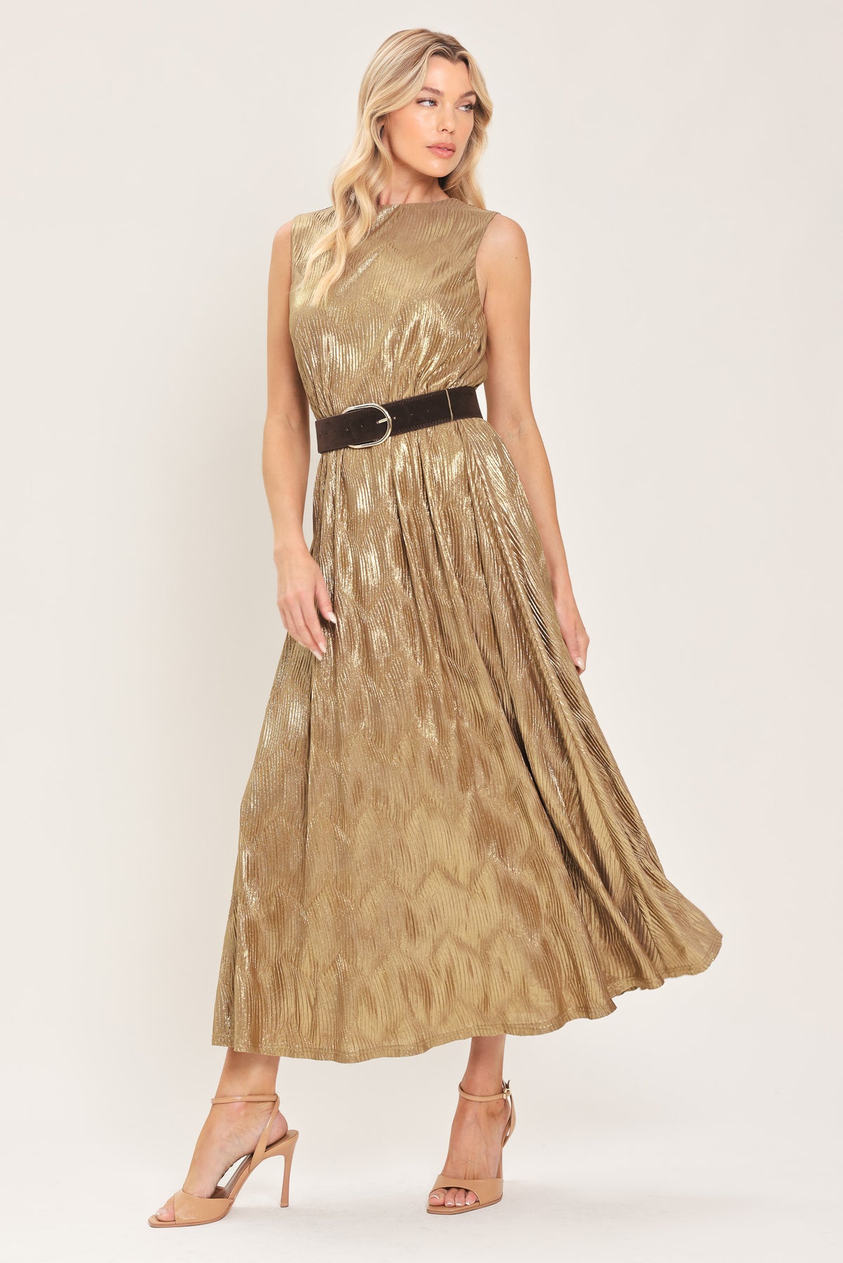 Woman wearing a sleeveless gold metallic like midi dress with dark brown suede waist belt | Flying Tomato