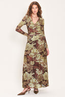 Woman wearing a dark maroon long sleeve mesh maxi dress with brown floral pattern and a waist tie belt that sits right above the hip | Flying Tomato