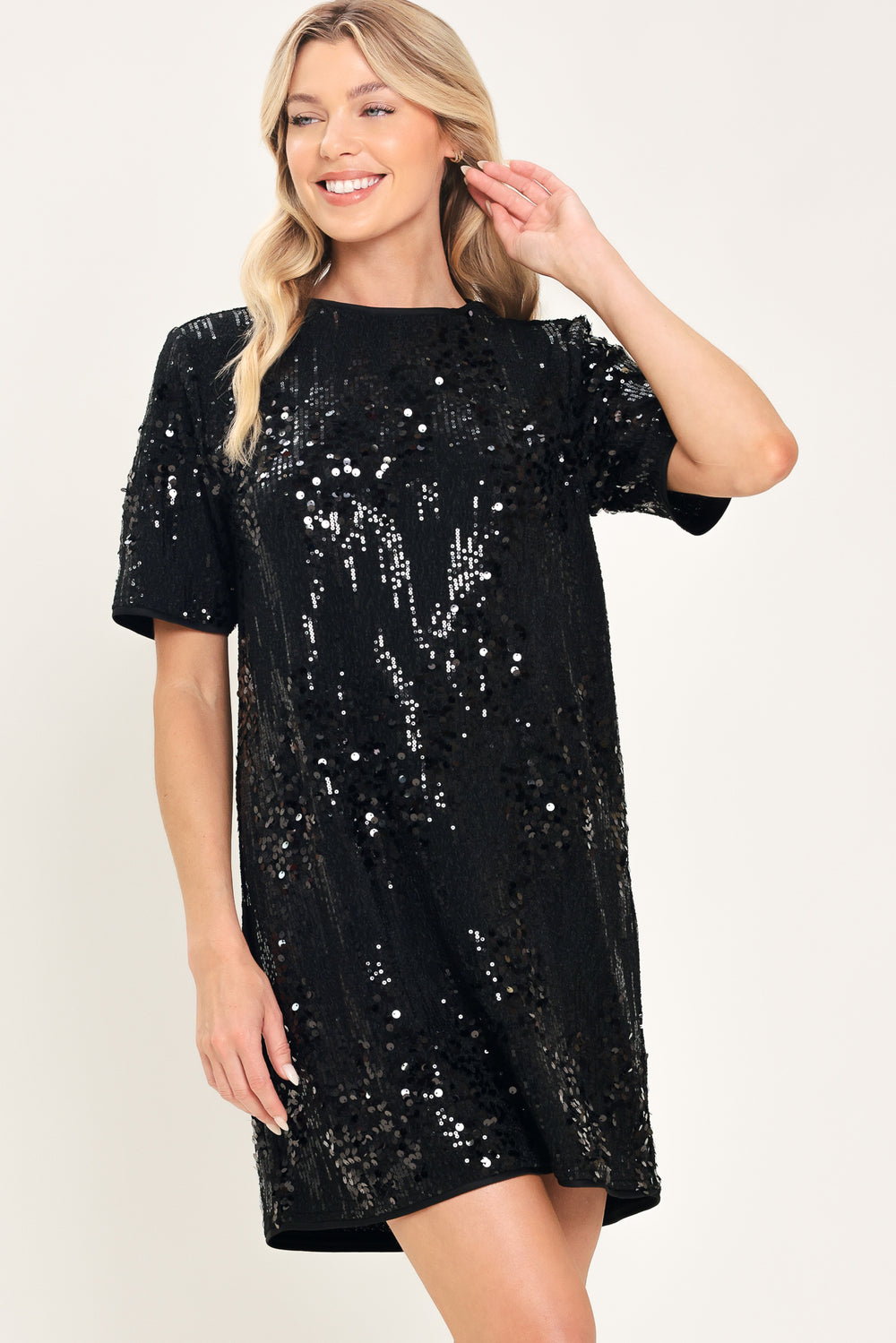 A woman modeling a short-sleeve black sequined mini dress | Flying Tomato