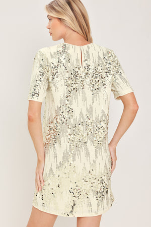 A woman modeling a short-sleeve cream sequined mini dress | Flying Tomato
