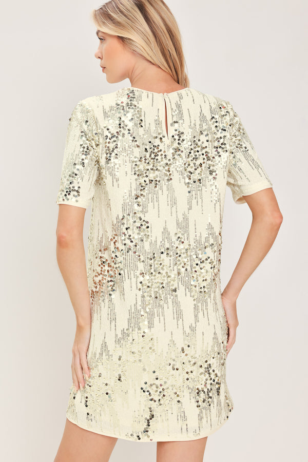 A woman modeling a short-sleeve cream sequined mini dress | Flying Tomato