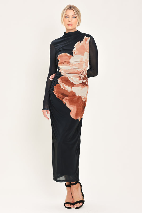 A woman modeling a black long-sleeve mock-neck mesh midi dress with a large abstract floral print in brown, beige, and white on the front | Flying Tomato