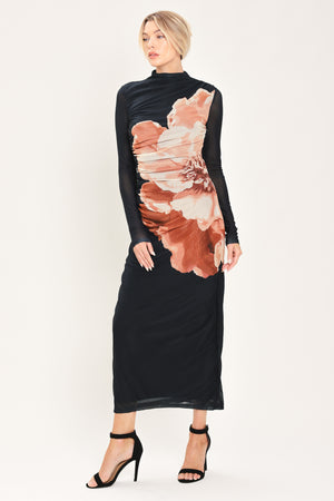 A woman modeling a black long-sleeve mock-neck mesh midi dress with a large abstract floral print in brown, beige, and white on the front | Flying Tomato