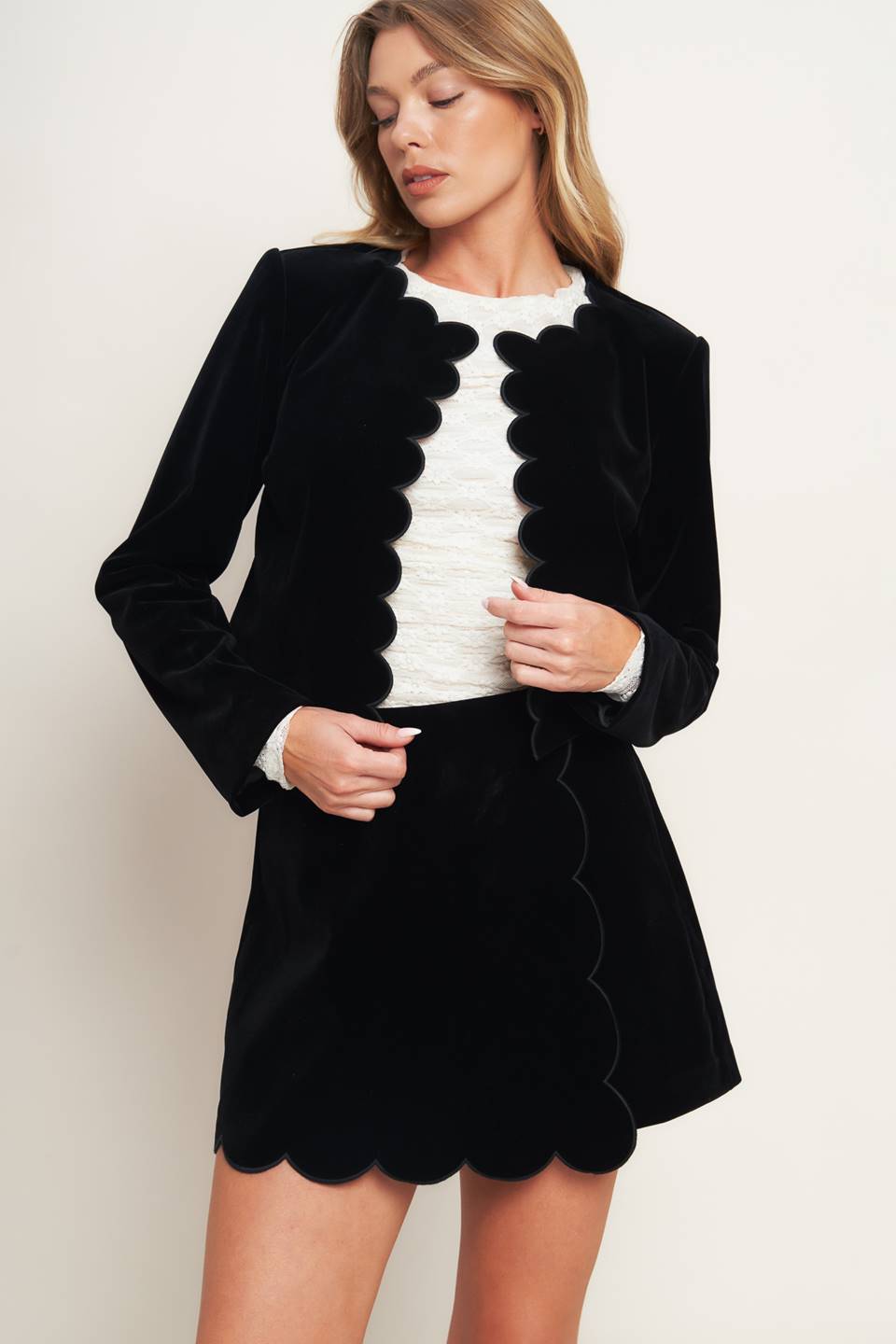A woven velvet crop jacket featuring round neckline, scalloped edge and long sleeve