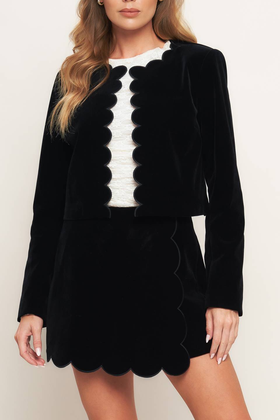 A woven velvet crop jacket featuring round neckline, scalloped edge and long sleeve