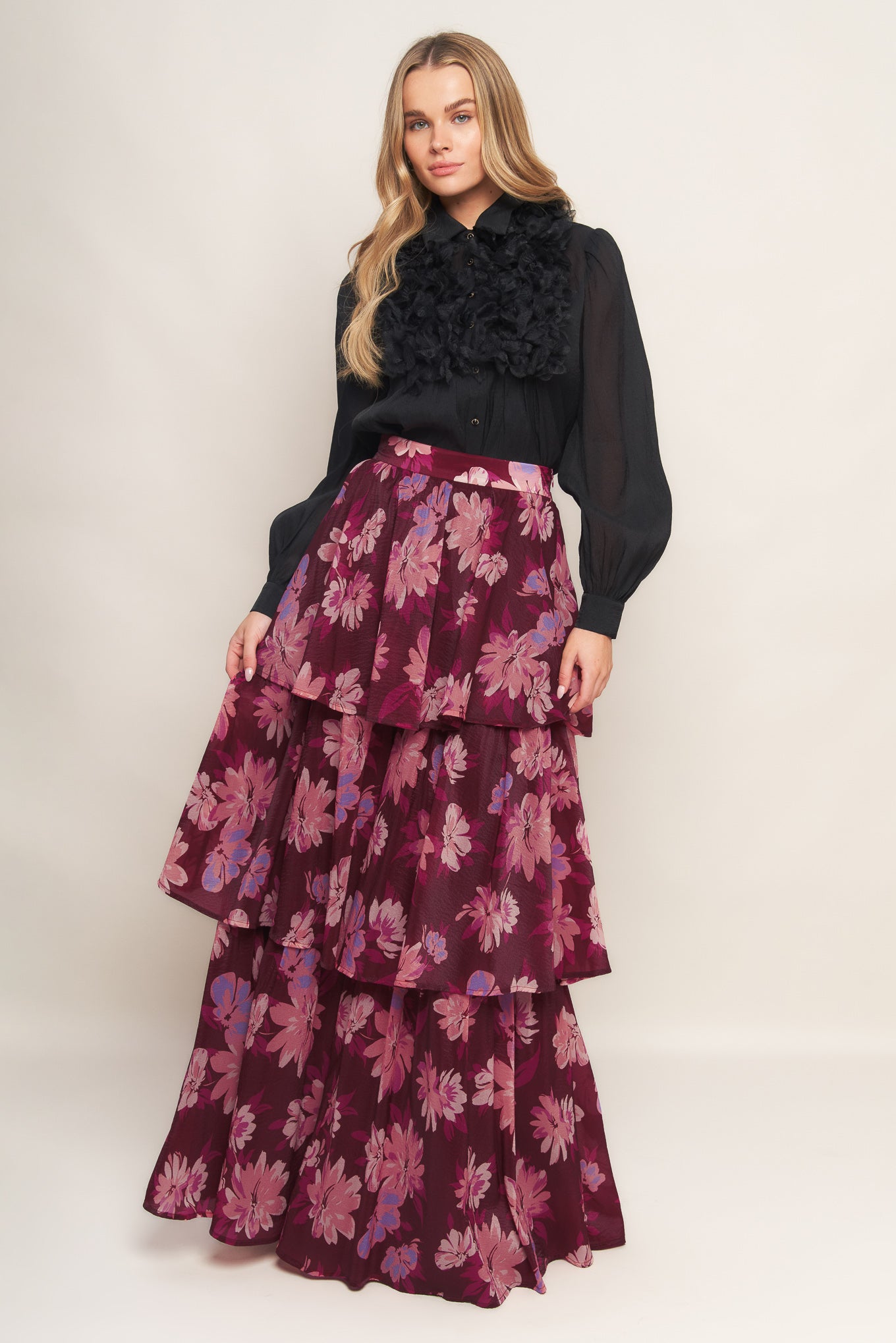 A printed woven maxi skirt with layers and side zipper closure. 