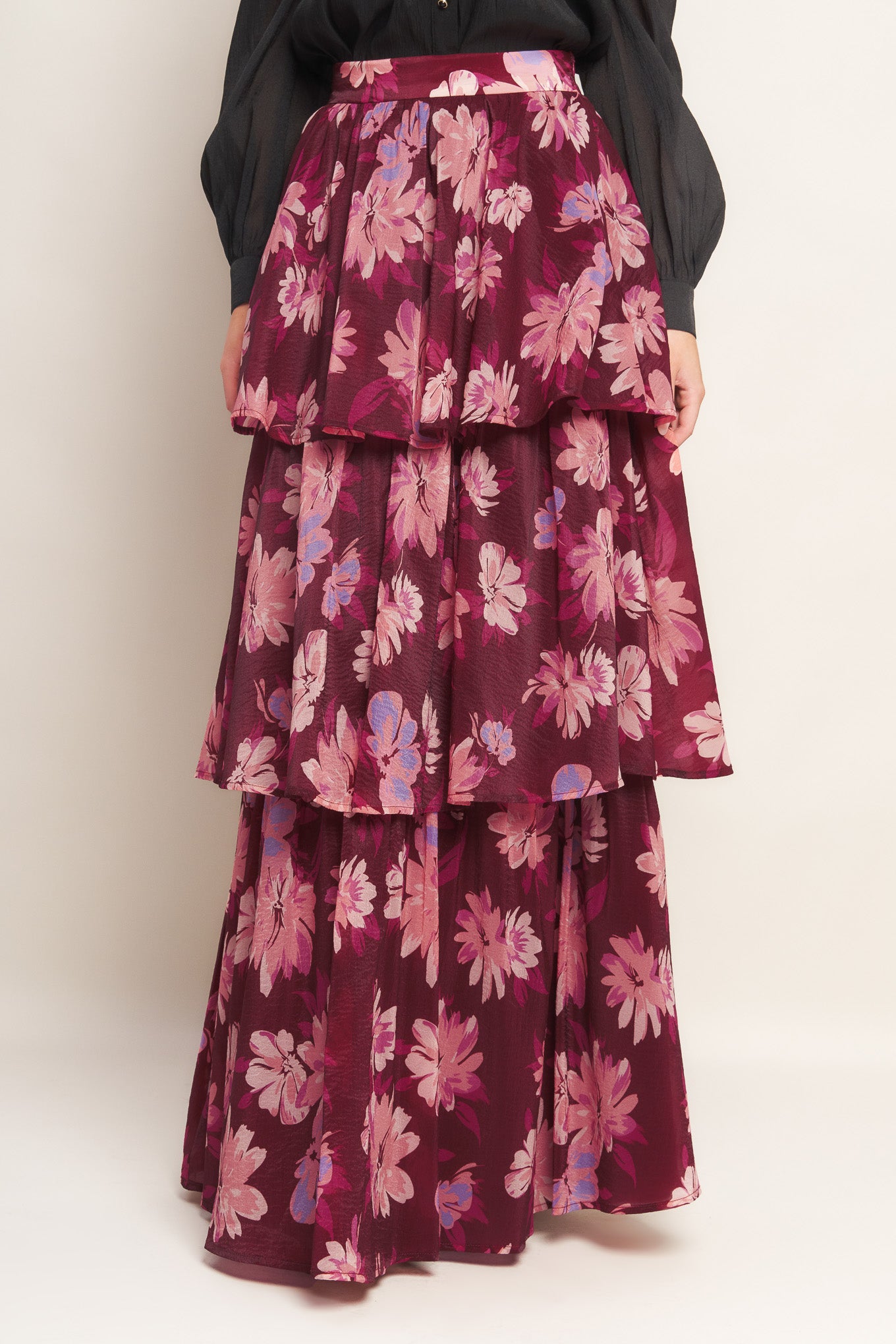 A printed woven maxi skirt with layers and side zipper closure. 